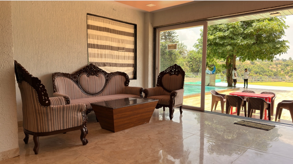 Bright Bungalow living room opening to the pool and garden